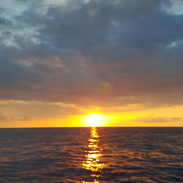 Sunset on the Pacific Ocean seen on a boat trip starting from Kona Big Island Hawaii